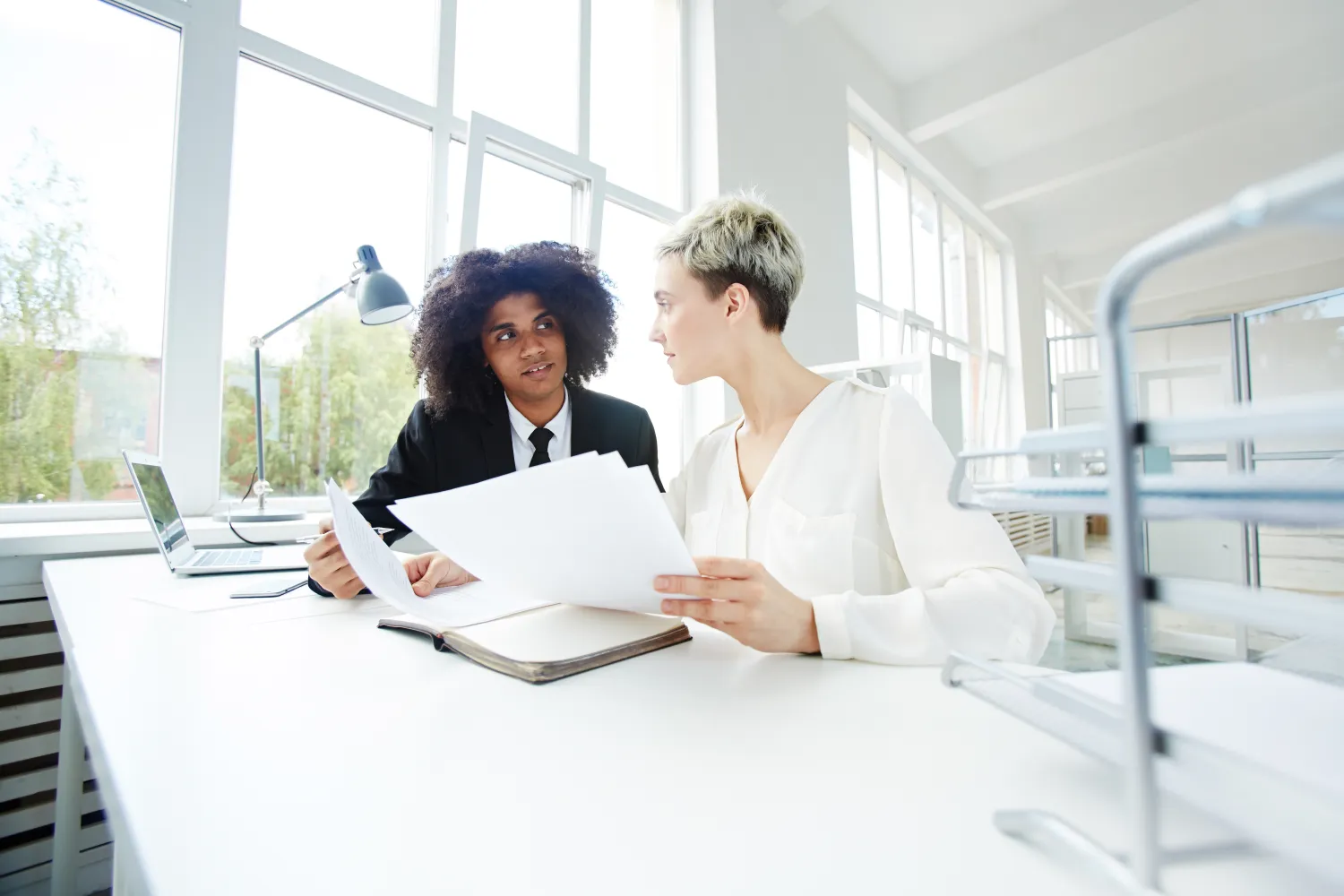 Accountants reviewing financial figures with a client