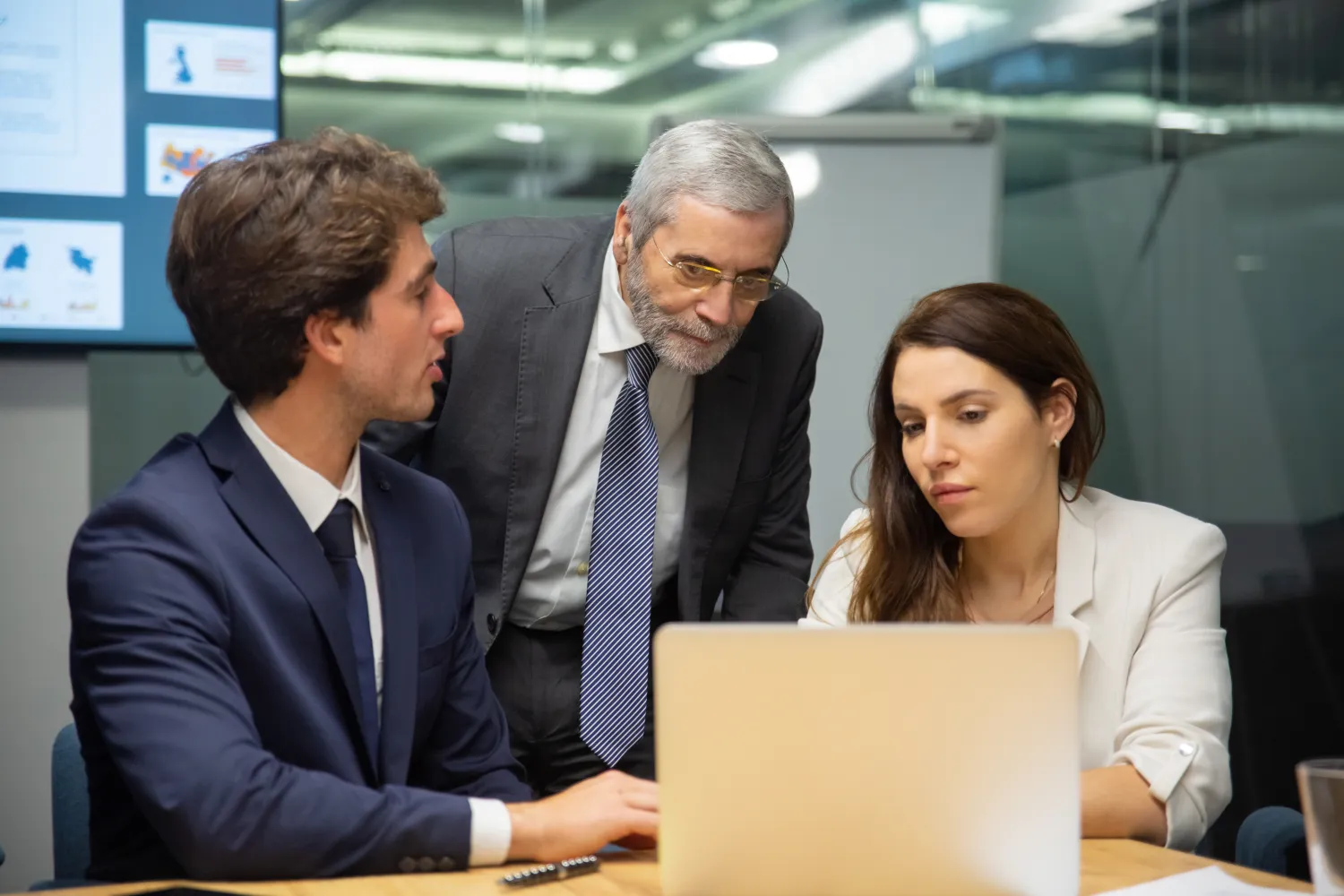 Business team reviewing results on a laptop