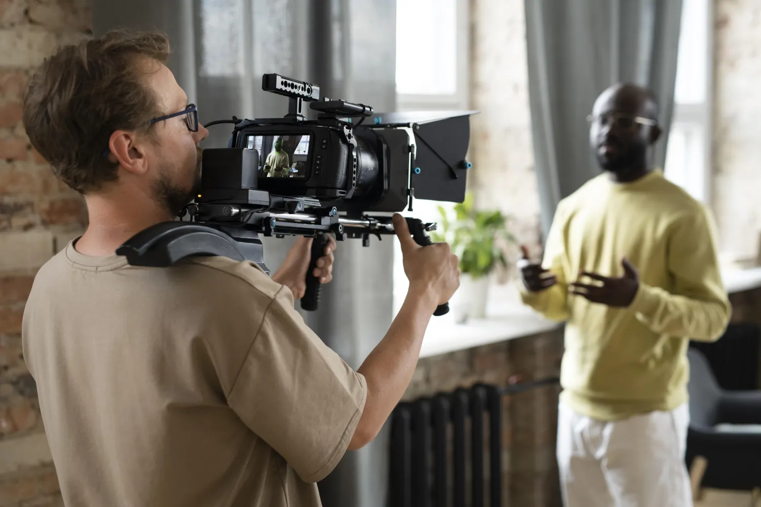 Videographer filming with a professional camera