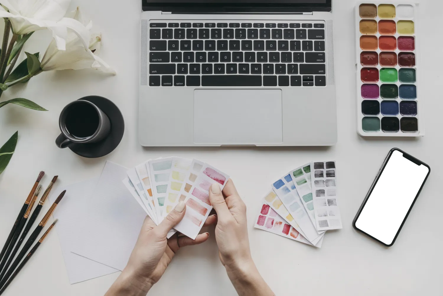 Brand identity design with colour swatches, brushes and devices