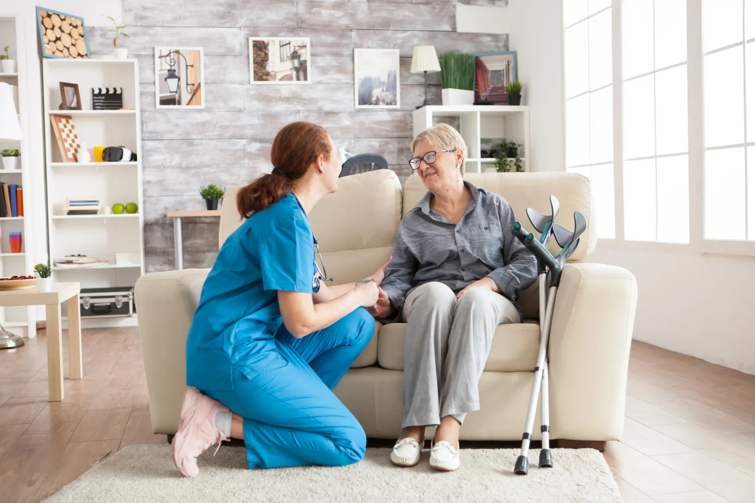 Nurse sitting with an elderly resident