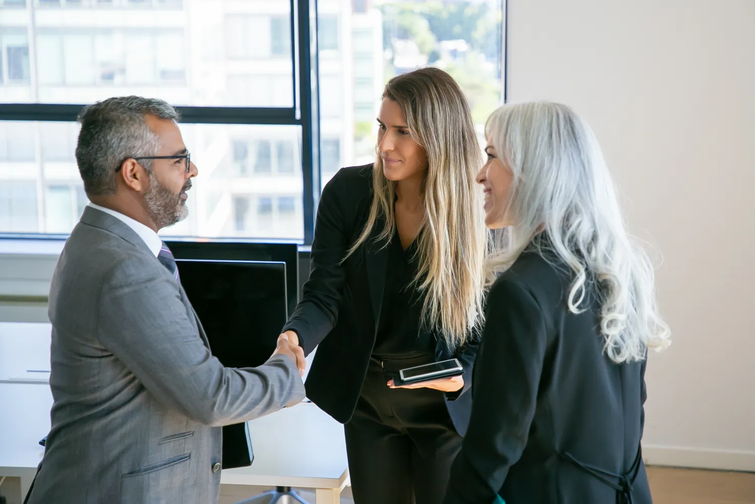 Marketing consultant meeting a client to discuss SEO strategy