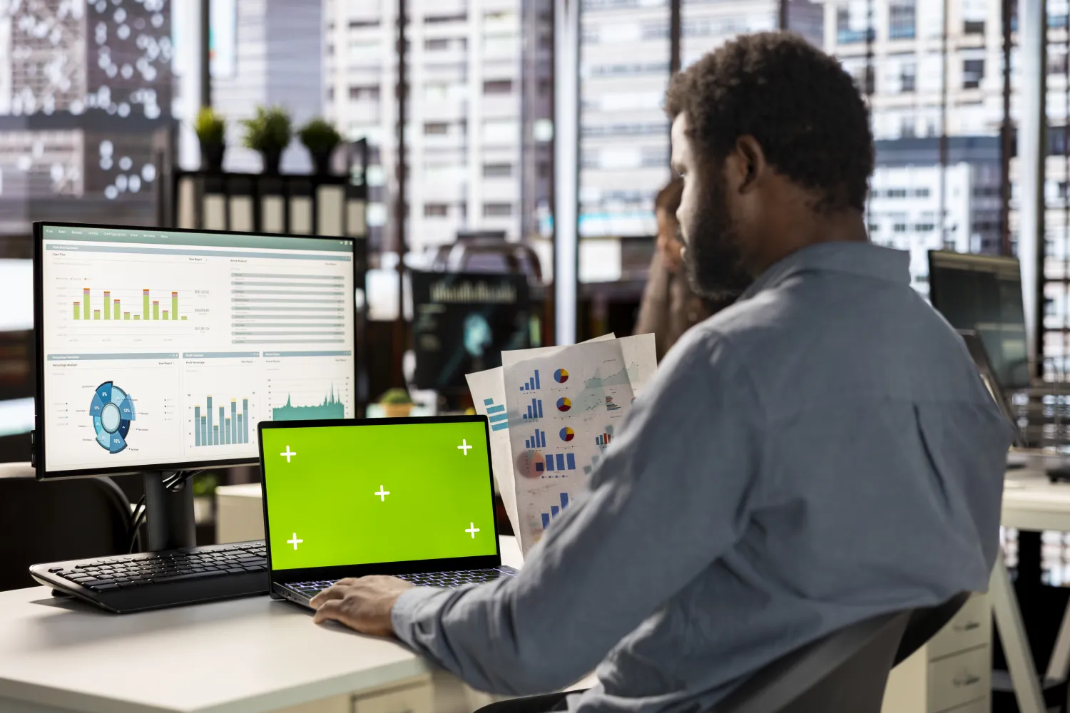 Analyst reviewing conversion data across screens