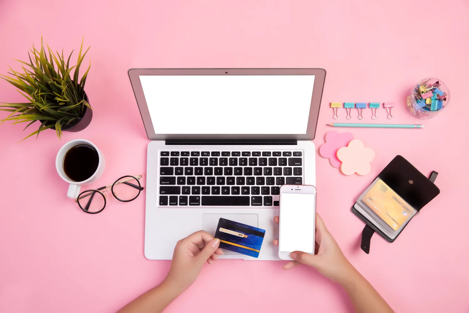 Customer completing an online purchase with a card on a laptop