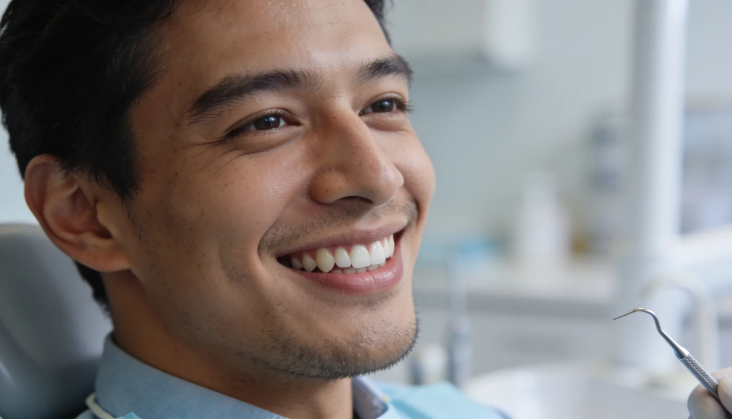 Patient smiling with healthy teeth after a dental checkup