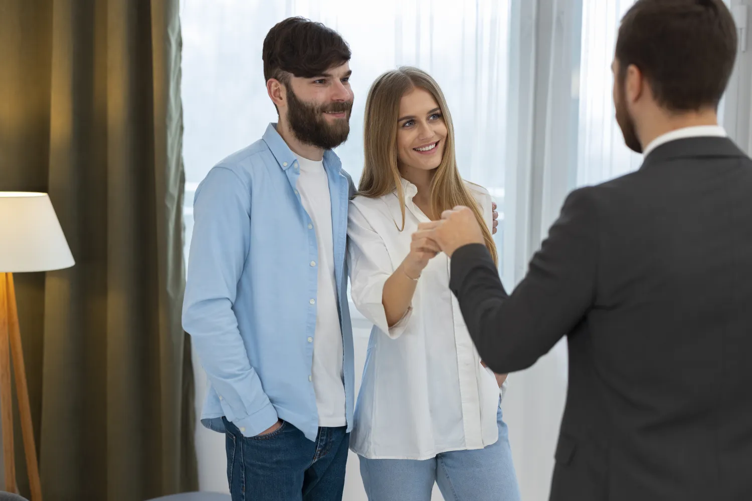 Estate agent agreeing an instruction with clients