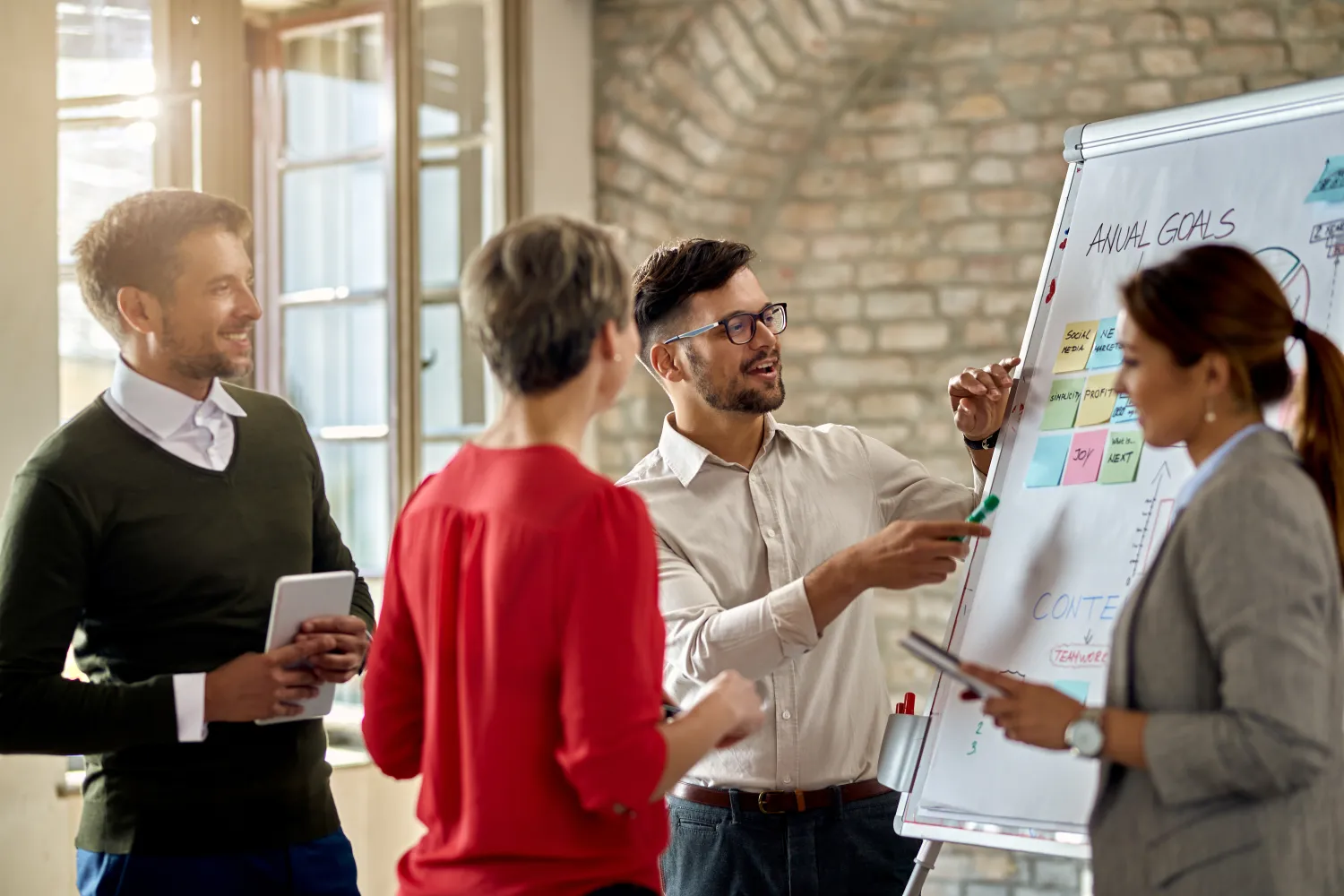 Team mapping a plan on a whiteboard
