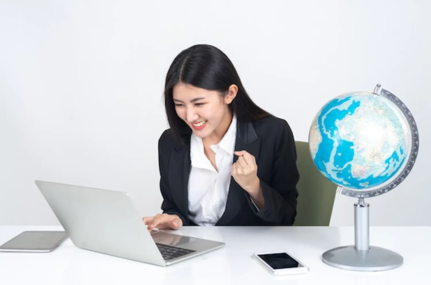 Business owner managing their online presence on a laptop