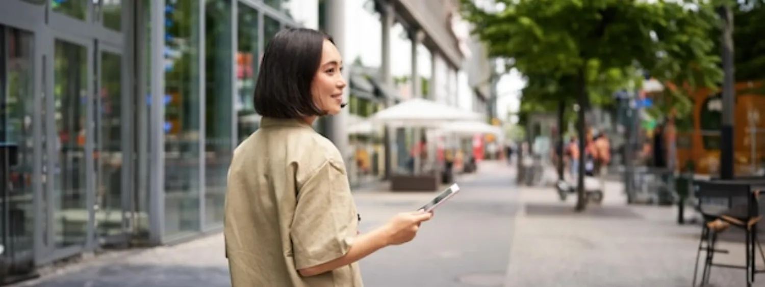 Customer finding a local business on their smartphone while out in the city