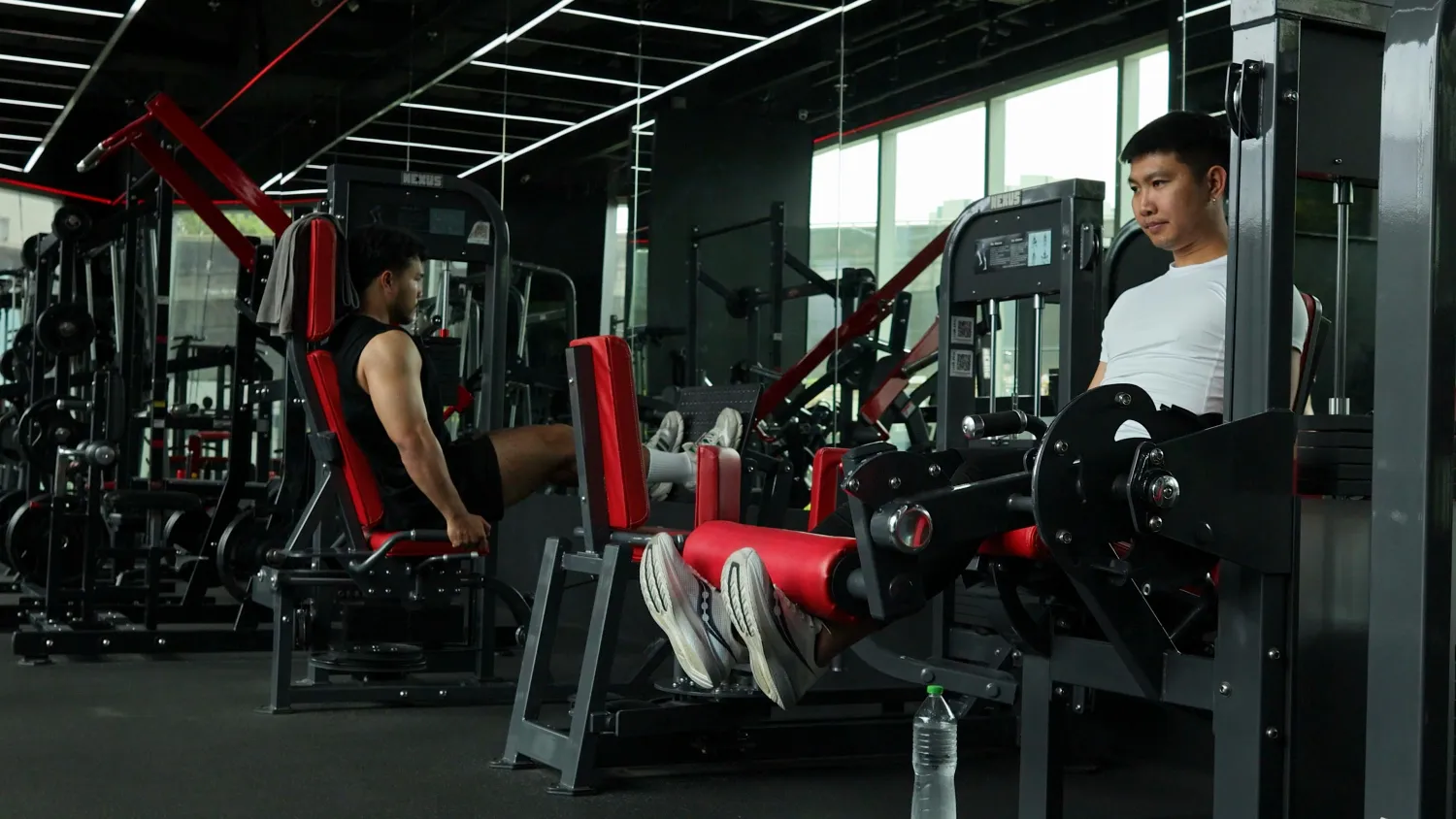 Person training on equipment in a modern gym