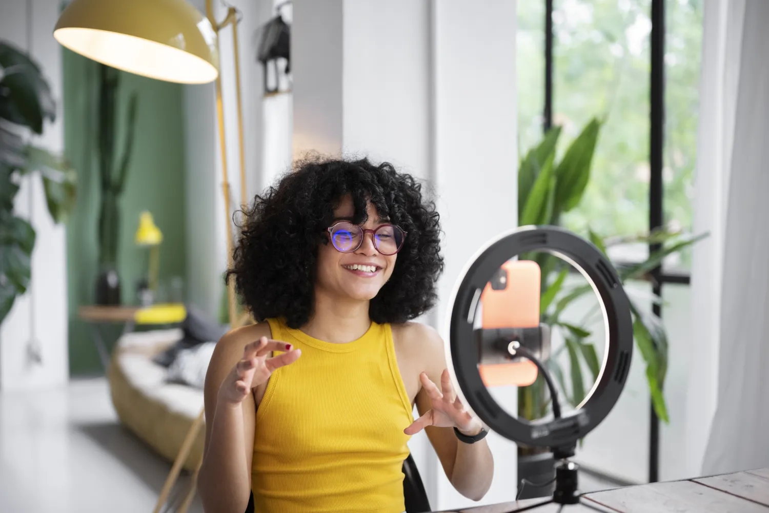 Content creator filming with a ring light