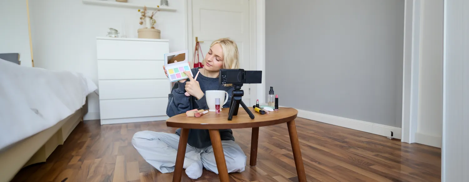 Person recording content for social media at home