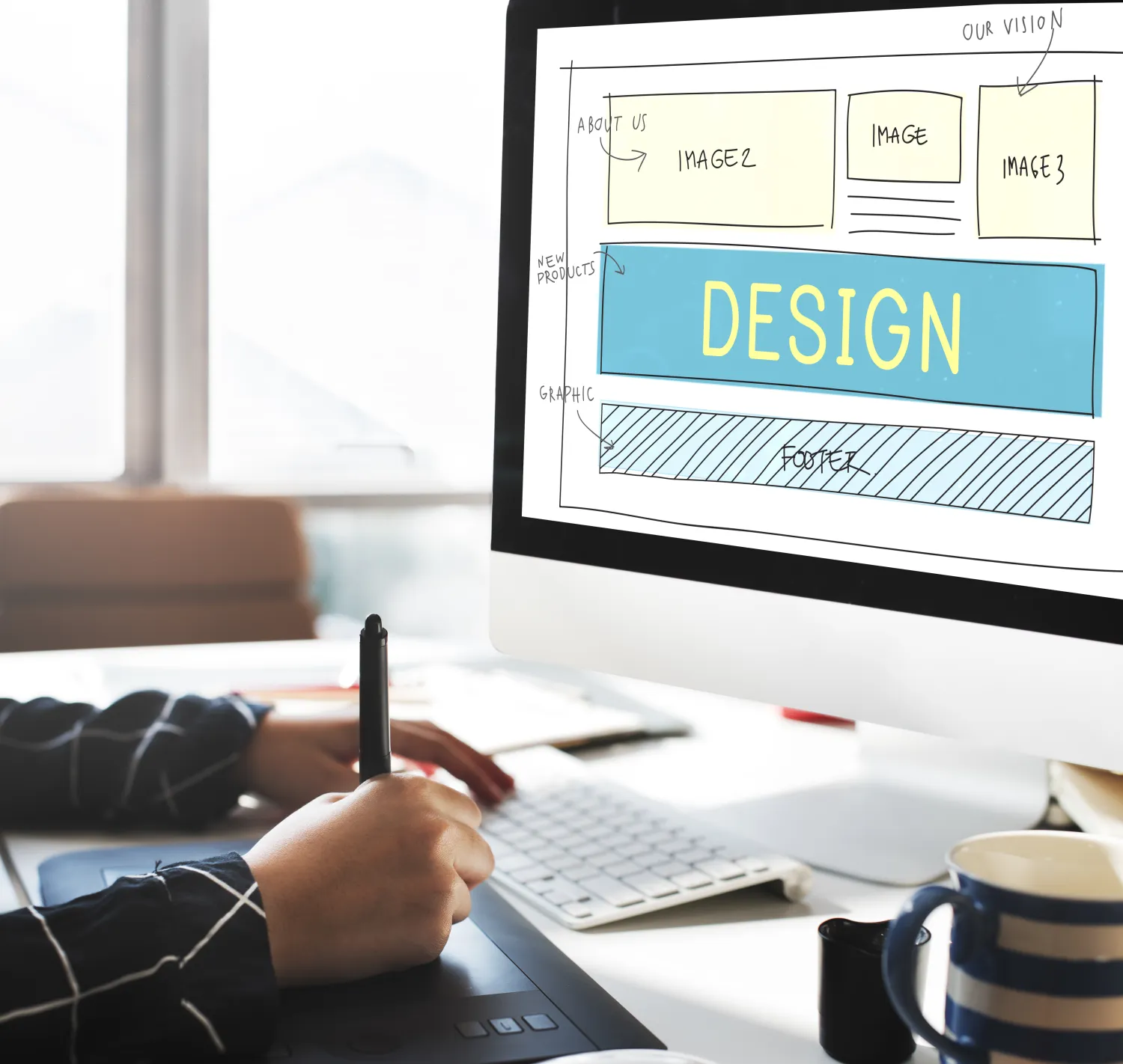 Designer sketching a web page layout