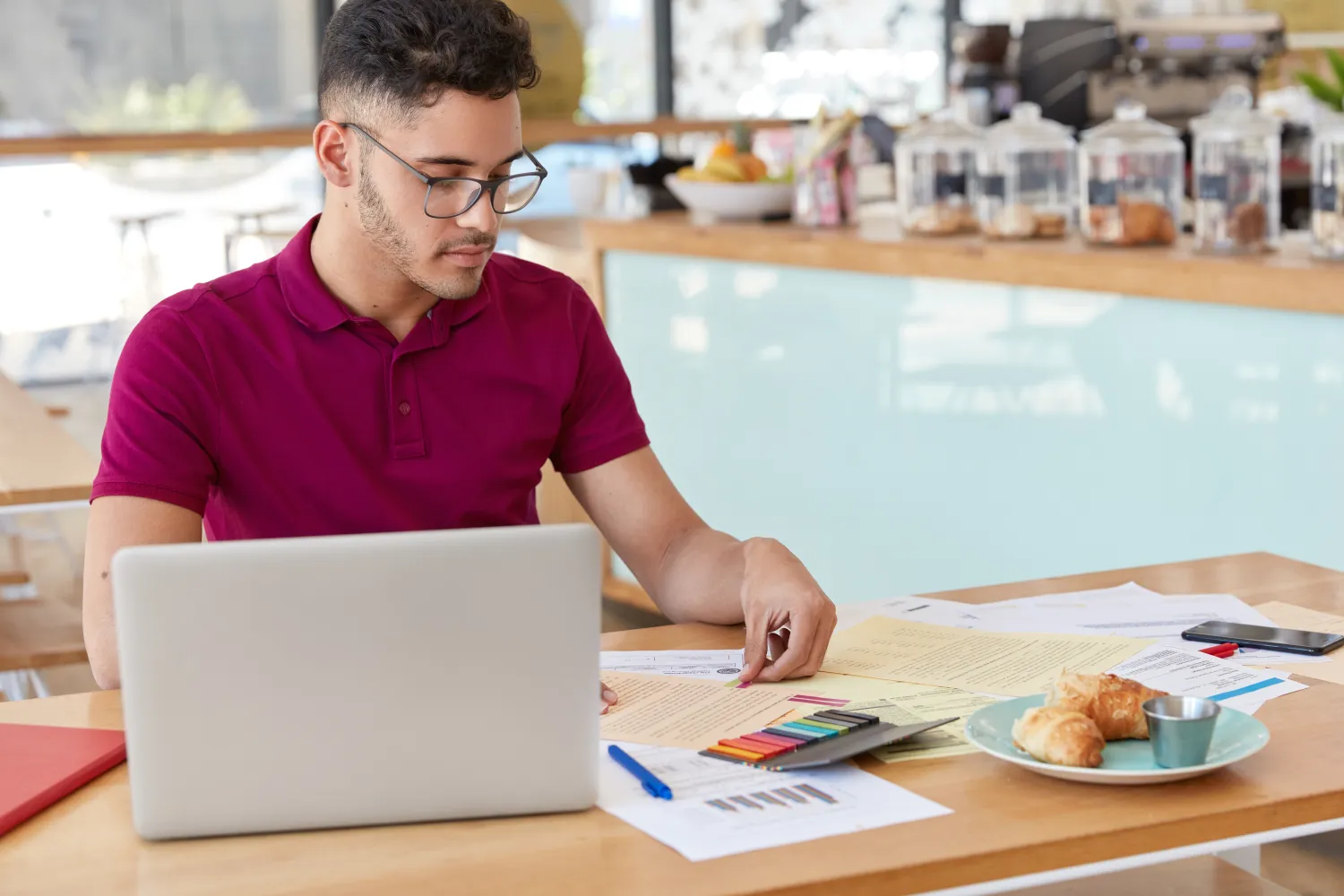 Person checking costs and finances at a laptop