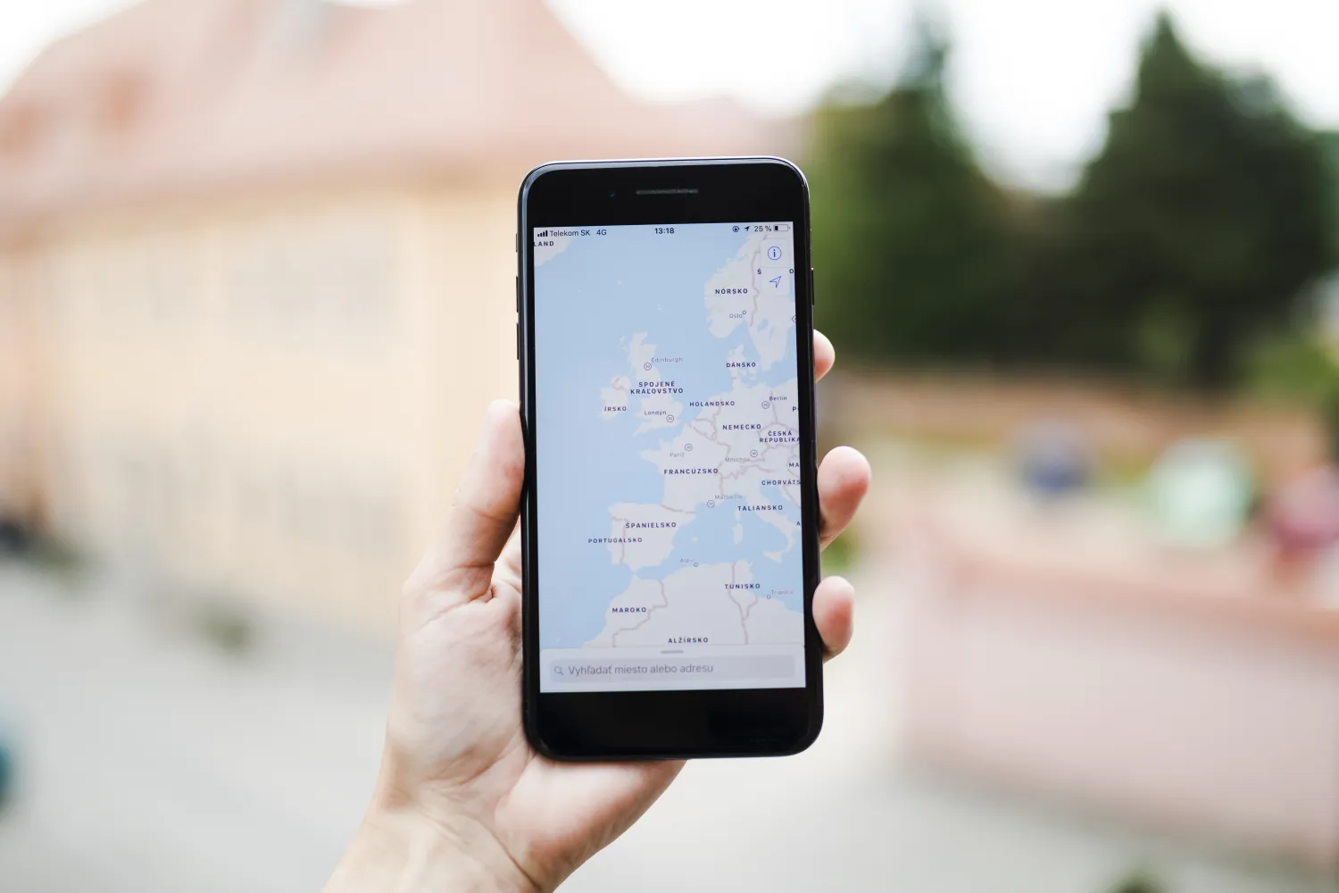Person searching for a local business on a map on their smartphone