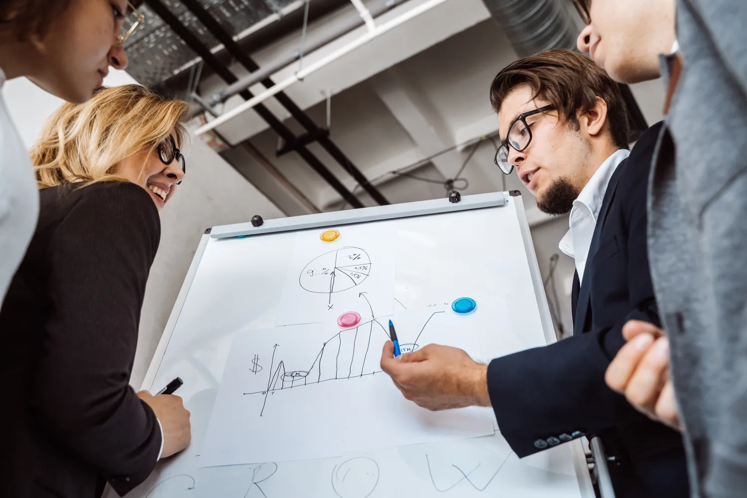 Team mapping out an SEO strategy on a whiteboard