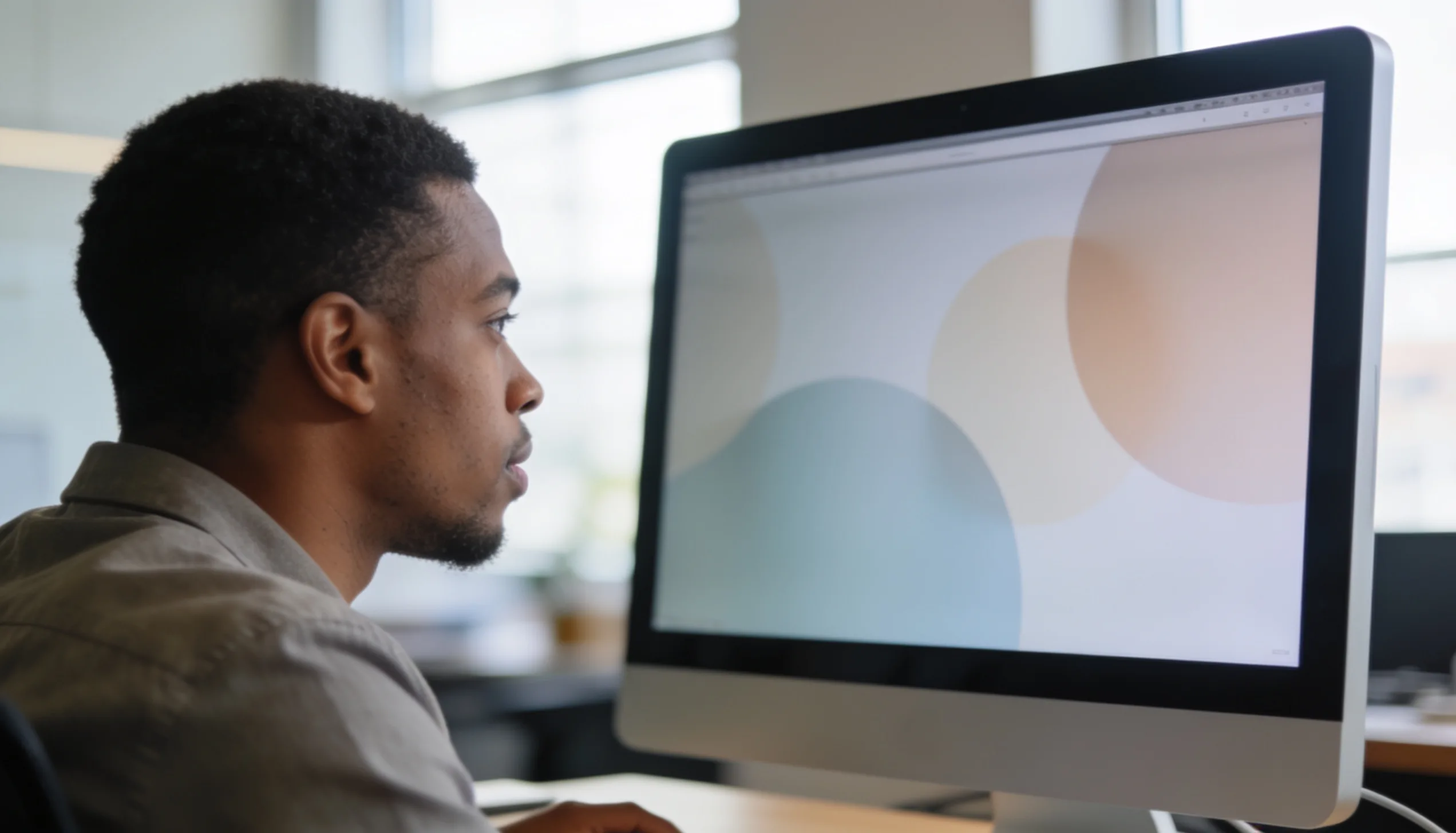 Marketer reviewing PPC campaign metrics and charts on a monitor