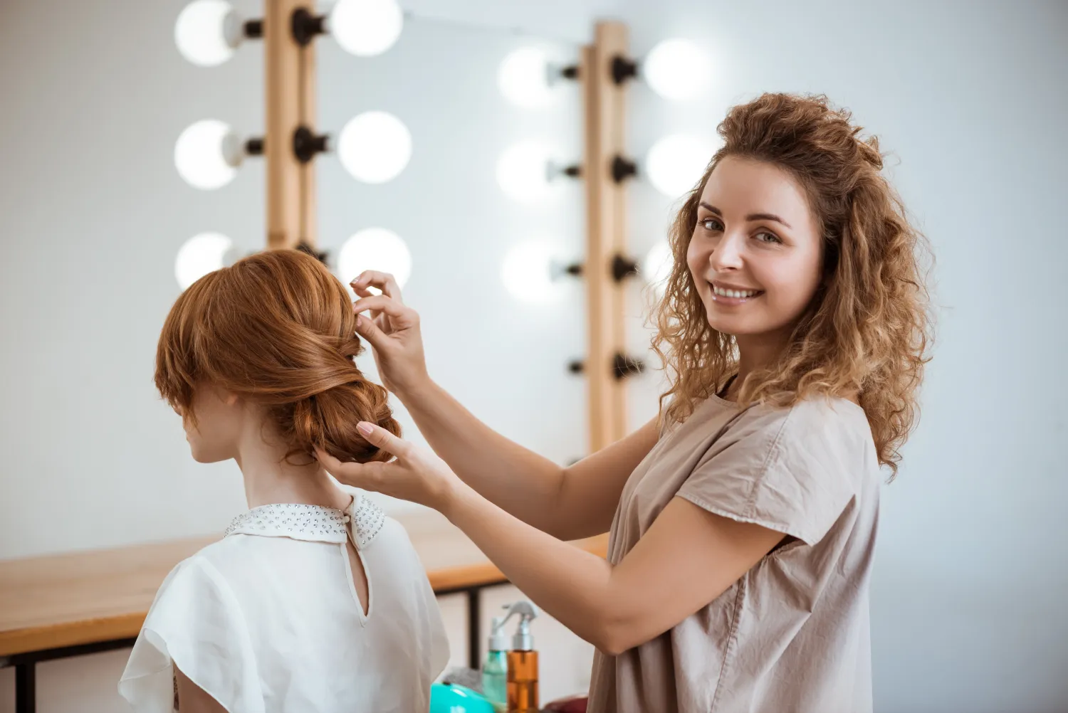 Hairdresser styling a client’s hair