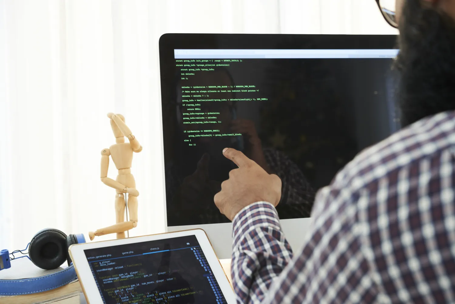 Developer reviewing code on screen