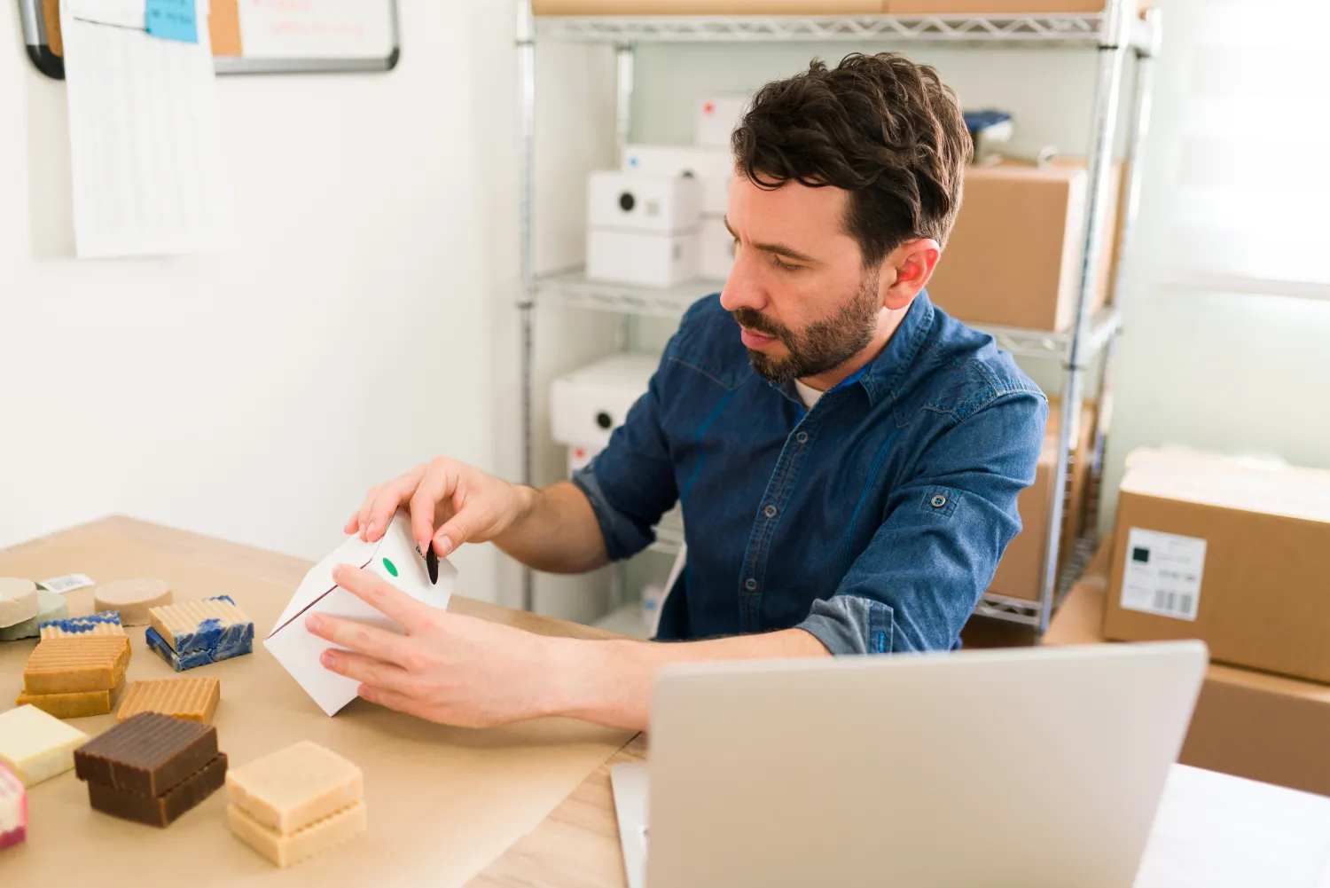 E-commerce business owner packing customer orders