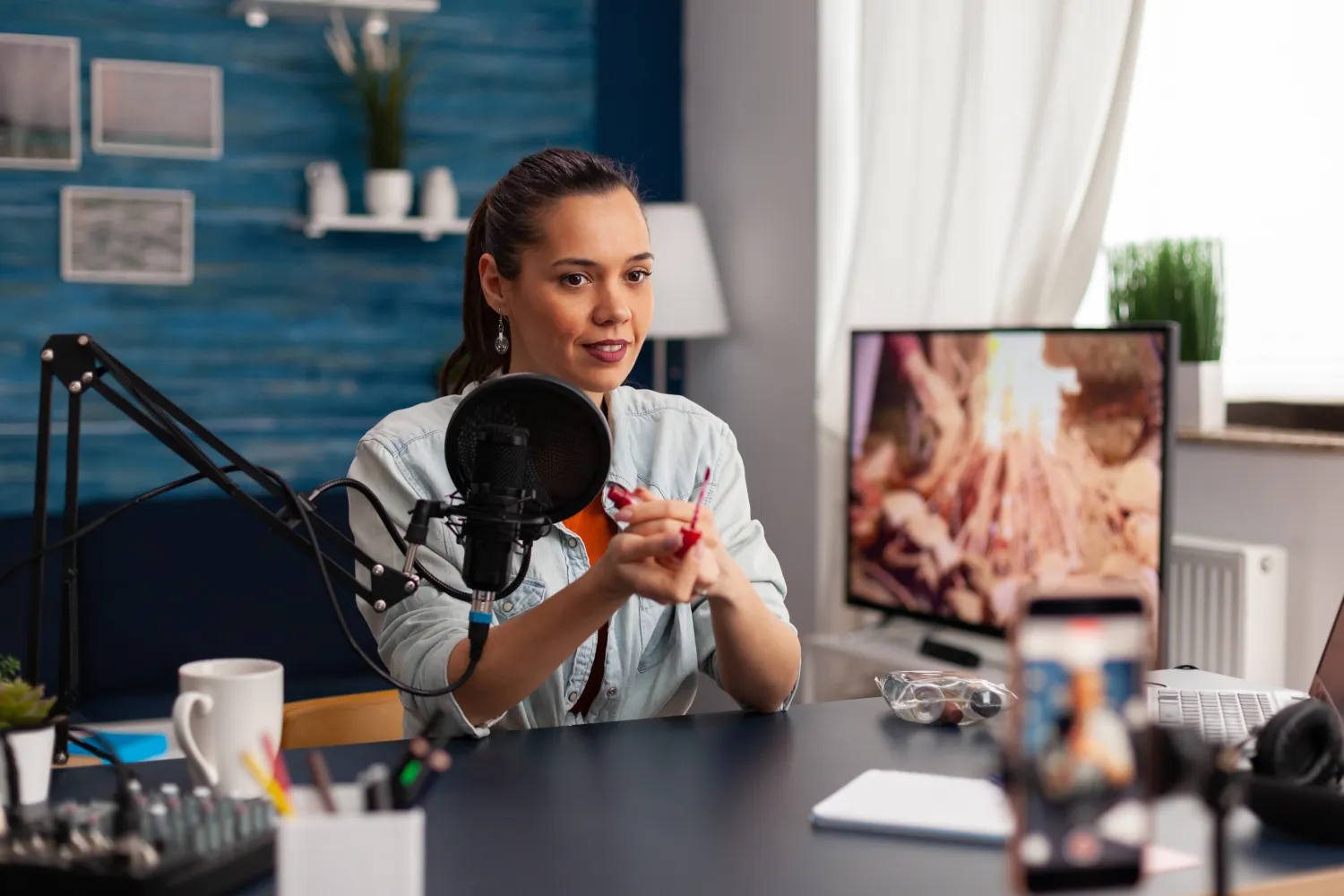 Creator recording social content with a microphone