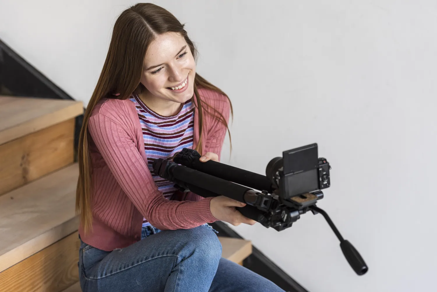 Creator filming a short video with a phone on a tripod