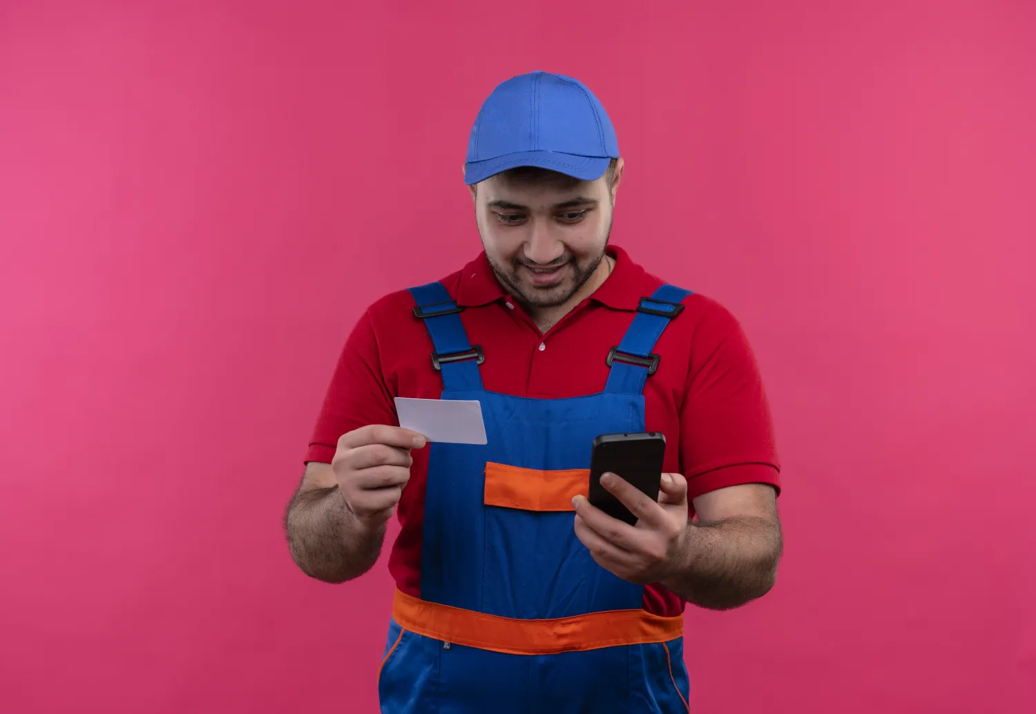 Builder checking job leads on his smartphone
