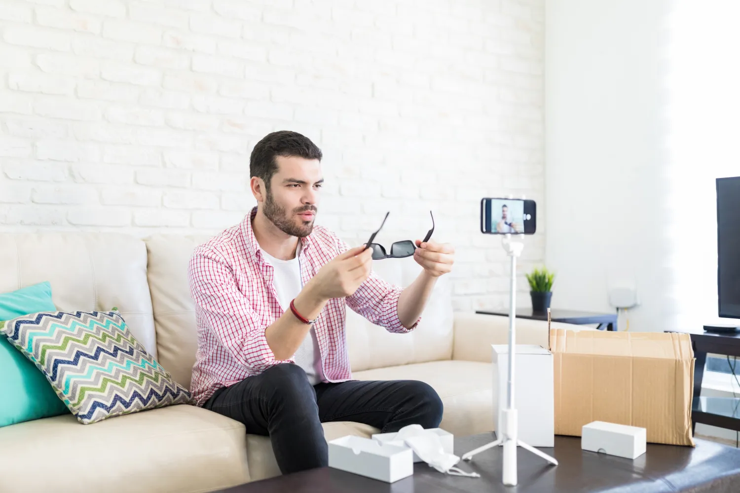 Creator recording a video with a smartphone on a tripod